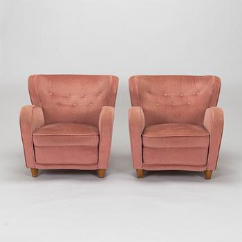 A pair of mid-20th century armchairs.