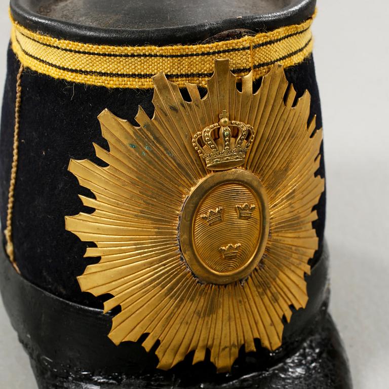 Five military helmets and a hat, late 19th and 20th century.