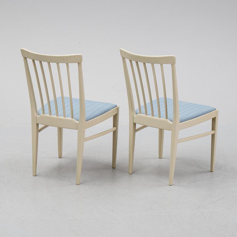 A dining table with six chairs by Carl Malmsten, second half of the 20th Century.