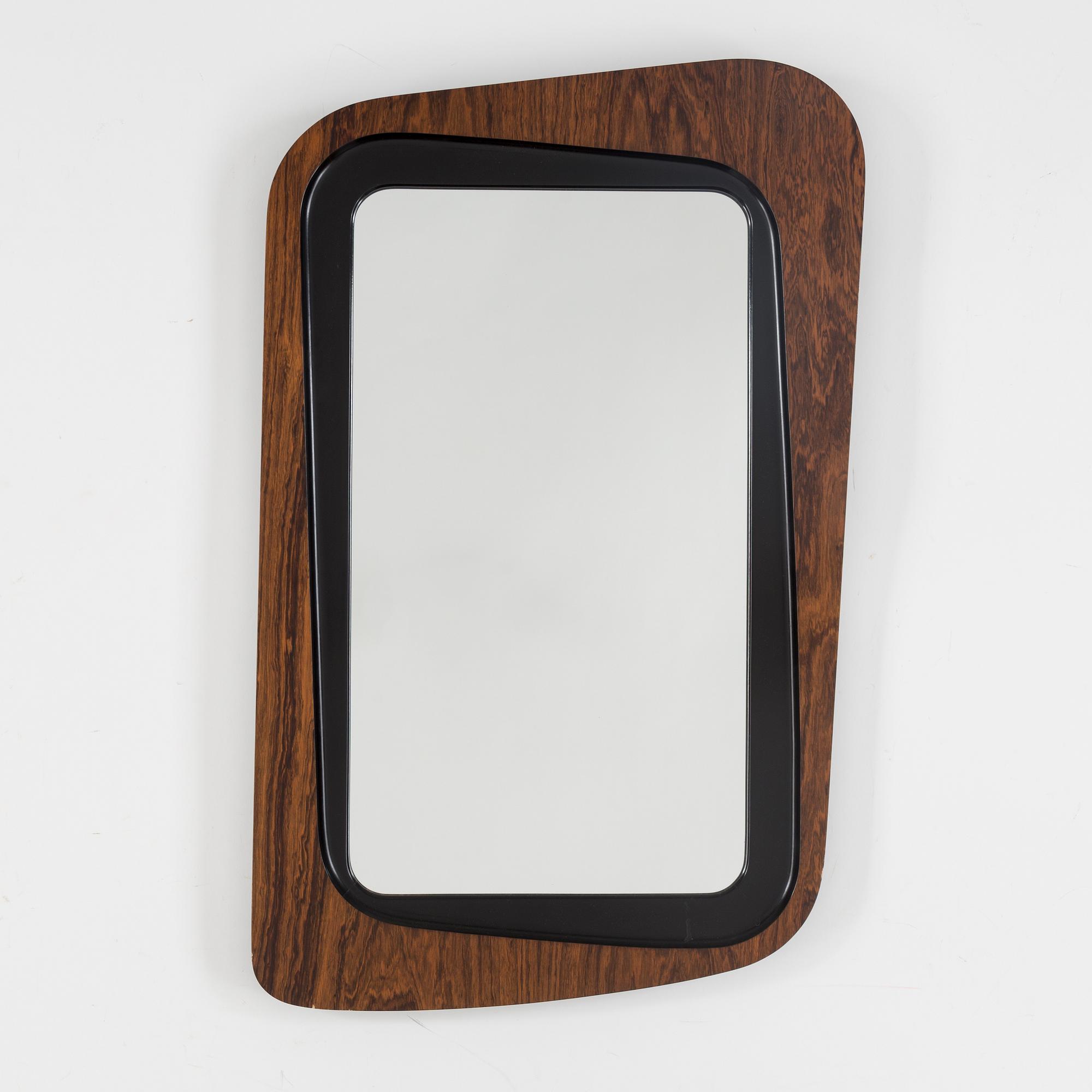 A second half of the 20th century rosewood mirror with table.