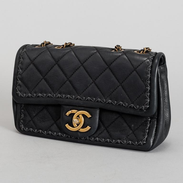CHANEL, a black quilted fabric 'Flap Bag', 2015-2016.