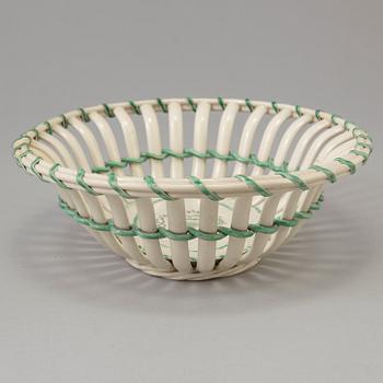 A CREAMWARE BASKET, PLATE AND A SIMILAR PLATE, one marked Wedgwood, first half of the 19th century.