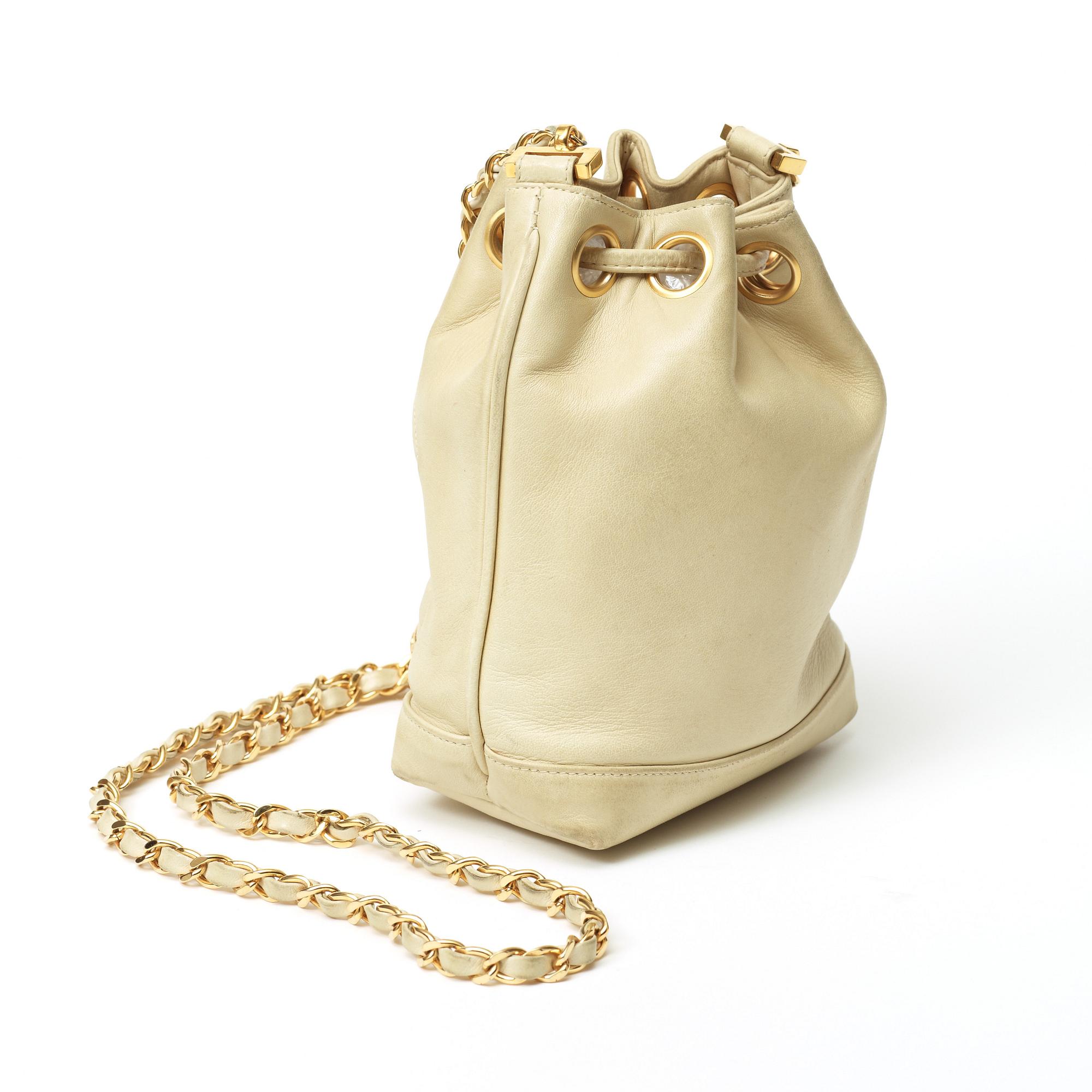 A 1980s cream colored shoulder bag by Chanel.