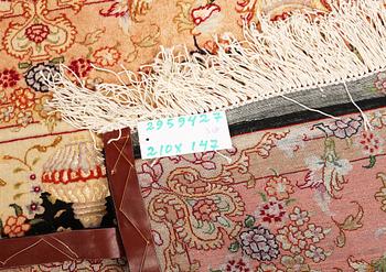 A Tabriz rug, a. 210 x 147 cm.