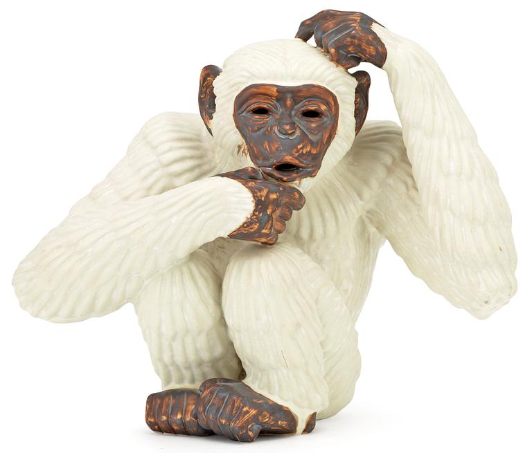 A Gunnar Nylund stoneware figure of a chimpanzee, Rörstrand.