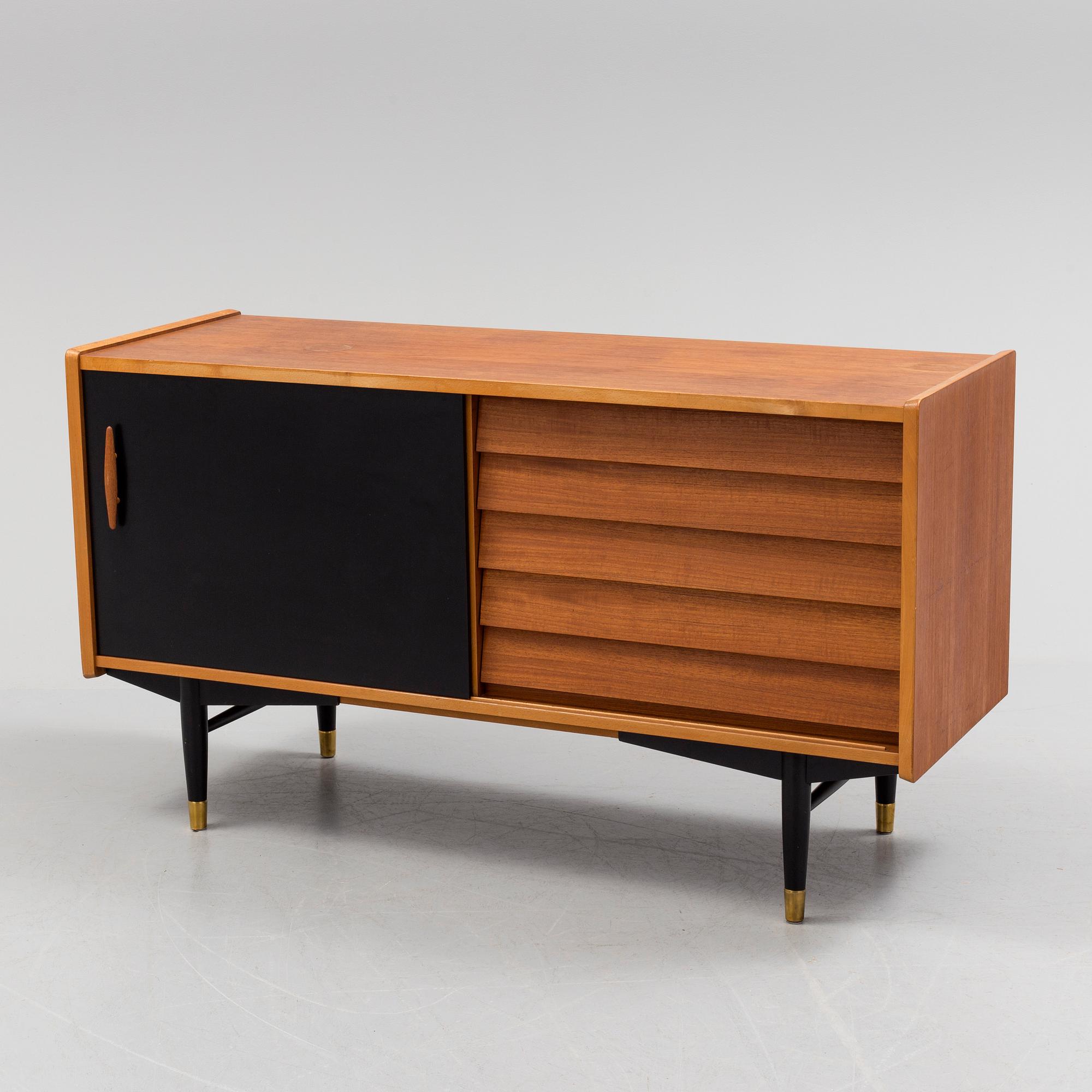 A 1950s / 60s Nils Jonsson sideboard veneered with teak model 222 from Hugo Troeds in Bjärnum.