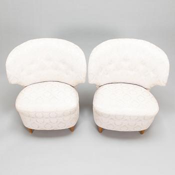 A pair of 1950's armchairs.