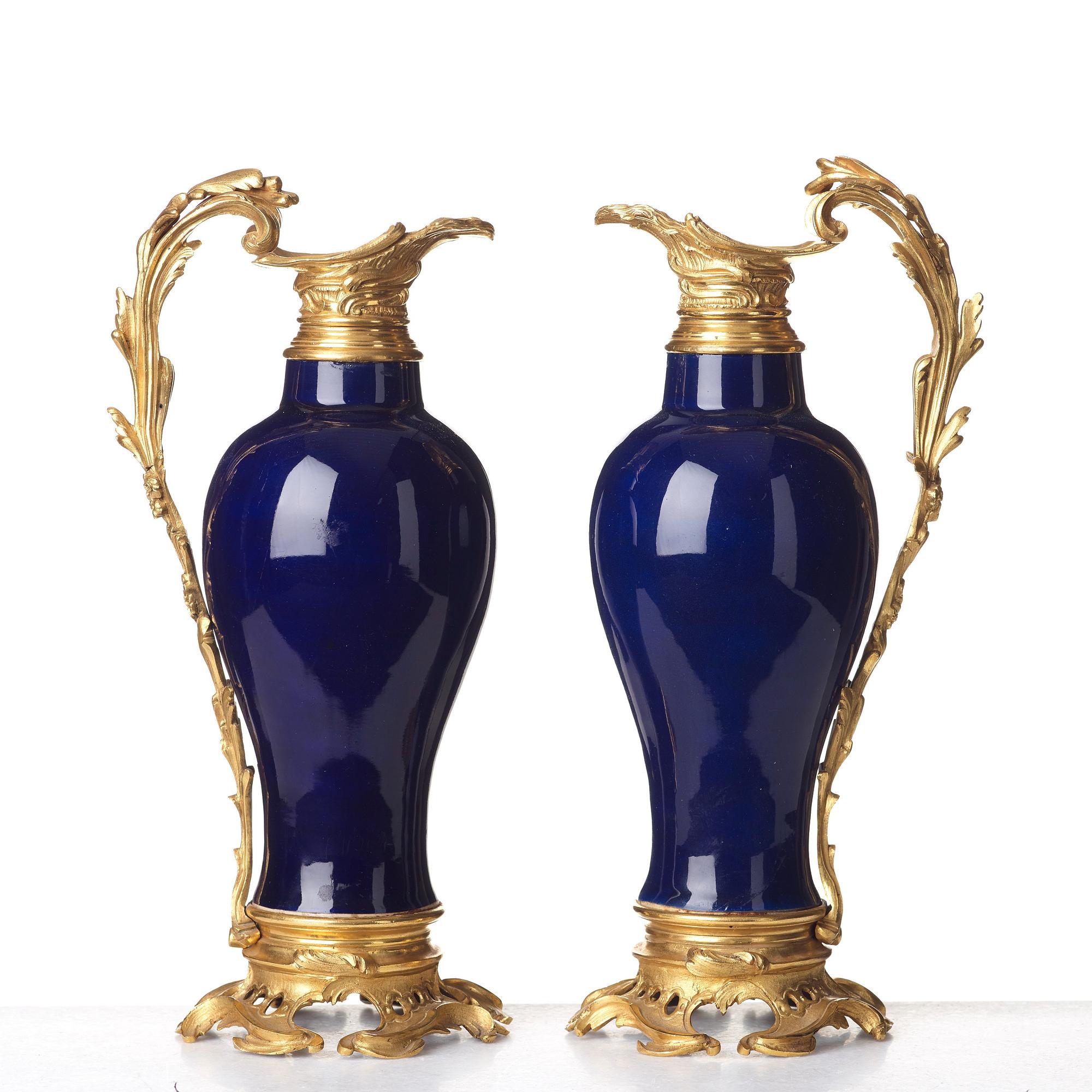 A pair of gilt bronze mounted vases, Qing dynasty, Qianlong (1736-95). French bronze mounts.