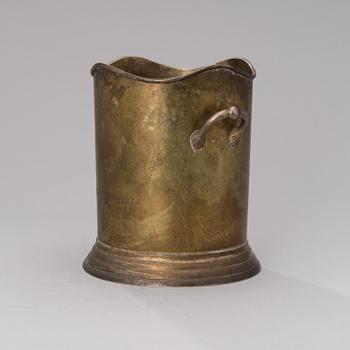 A Louis Roederer champagne cooler of silver plated brass.