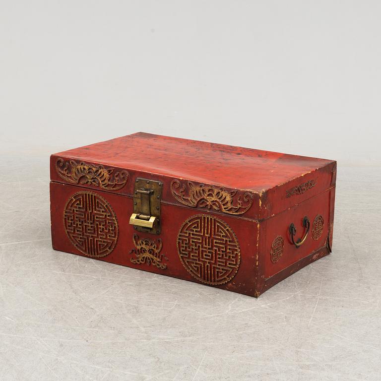 A Chinese red leather and wooden box, 20th century.