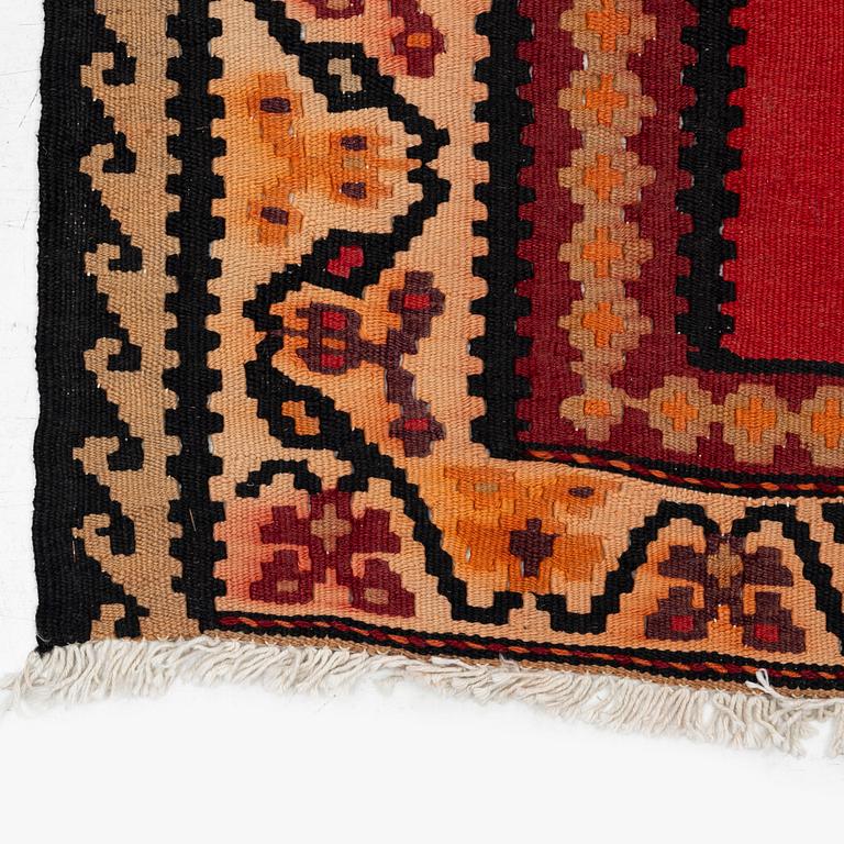 A Kilim rug, c. 300 x 165 cm.