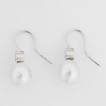 A pair of cultured South Sea pearl and diamond earrings. Total carat weight of diamonds 0.24 ct.