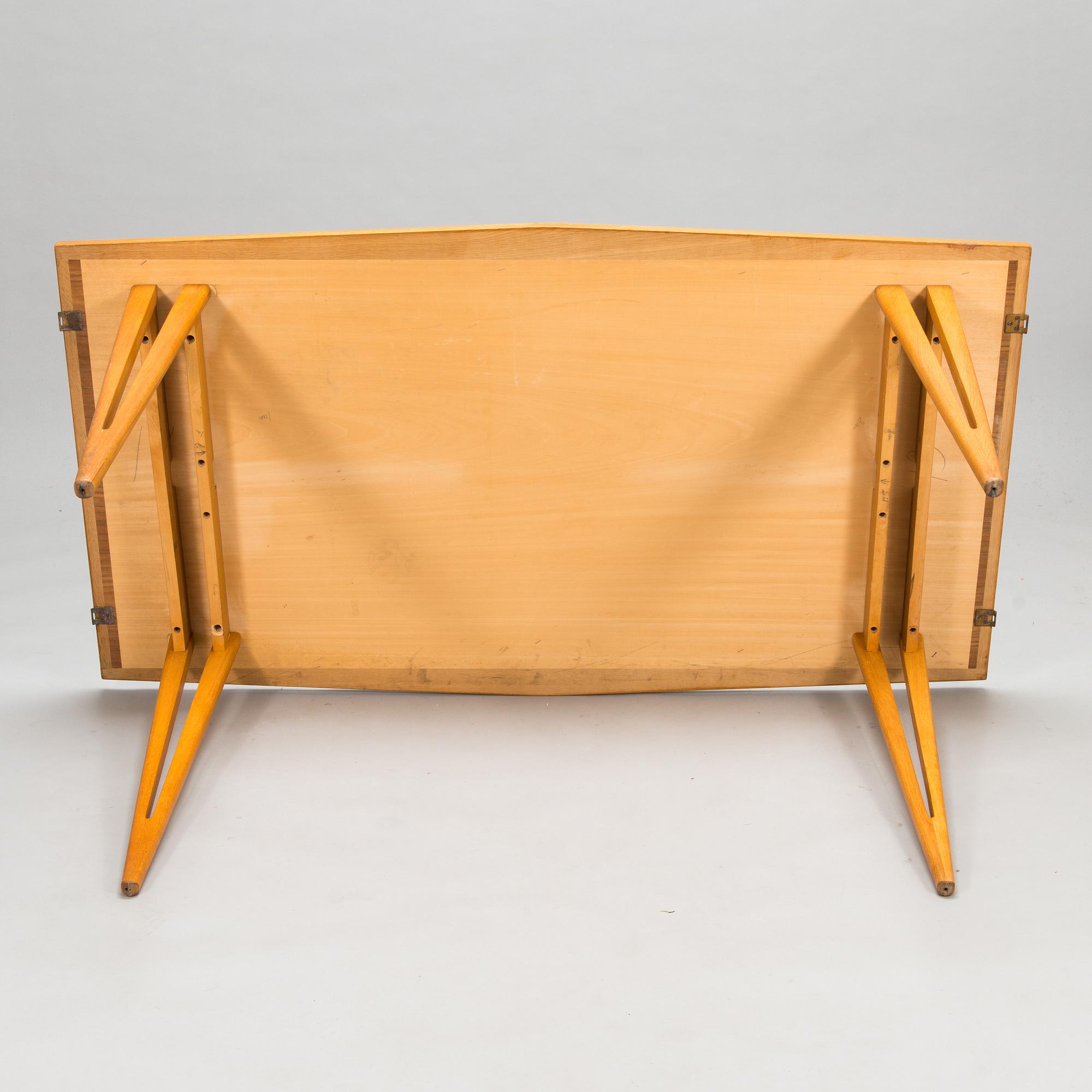 A mid-20th century dining table.
