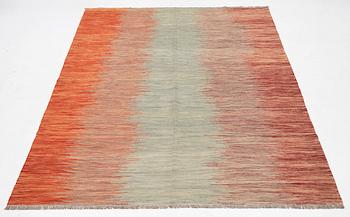 A kilim carpet, 304 x 203 cm.