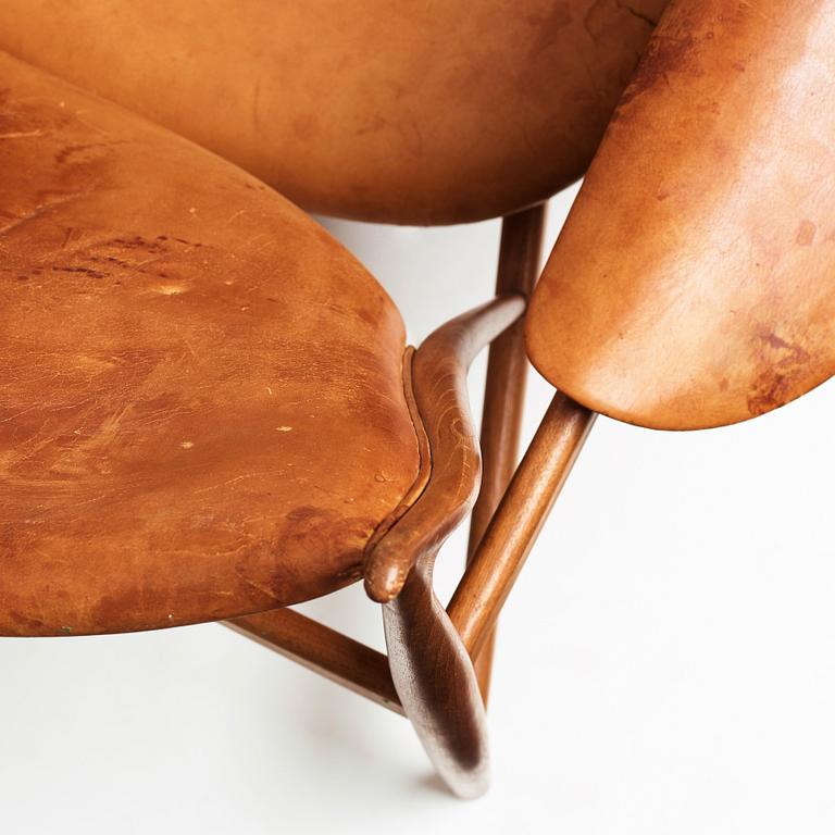 Finn Juhl, a teak and natural brown leather "Chieftain Chair" by Niels Vodder, 1950-60's.