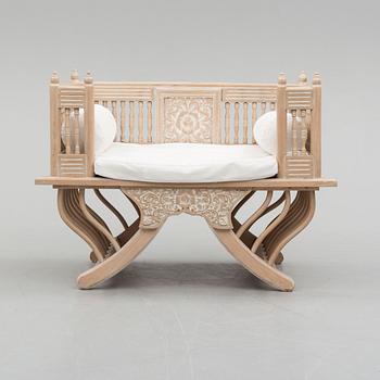 an elephant chair from the late 20th century.