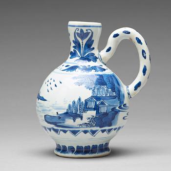 A blue and white Transitional ewer, 17th Century.