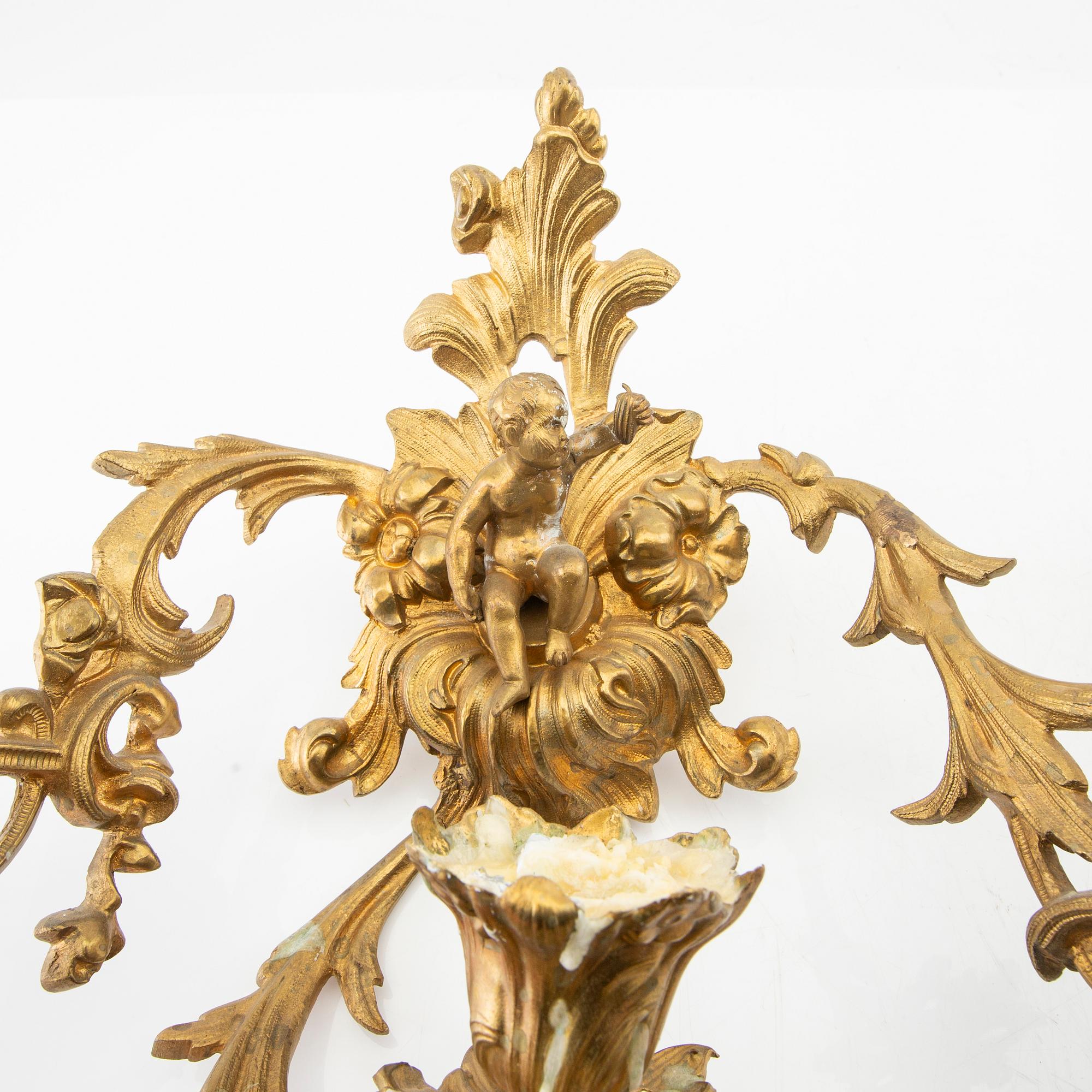 A pair of Louis XV style appliqués, late 19th century.