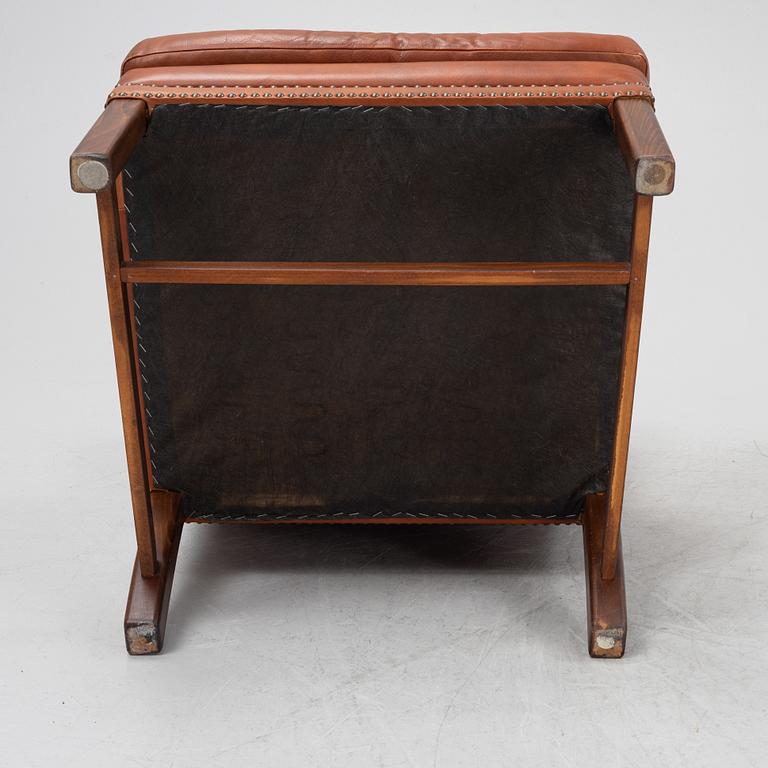 A leather upholstered easy chair, second part of the 20th Century.