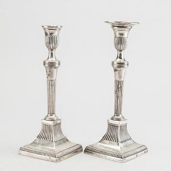 A pair of silver candle sticks around 1800 possibly Portugal, weight ca 734 gr, height ca 23 cm.