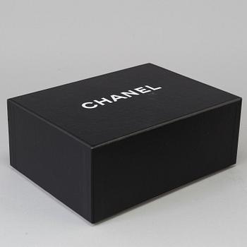 A black lacquer "Classic mini" bag by Chanel 2009-2010.