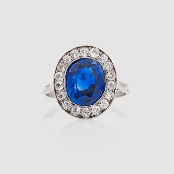 An untreated sapphire, 4.48 cts and brilliant-cut diamonds, circa 0.75 ct in total, ring.