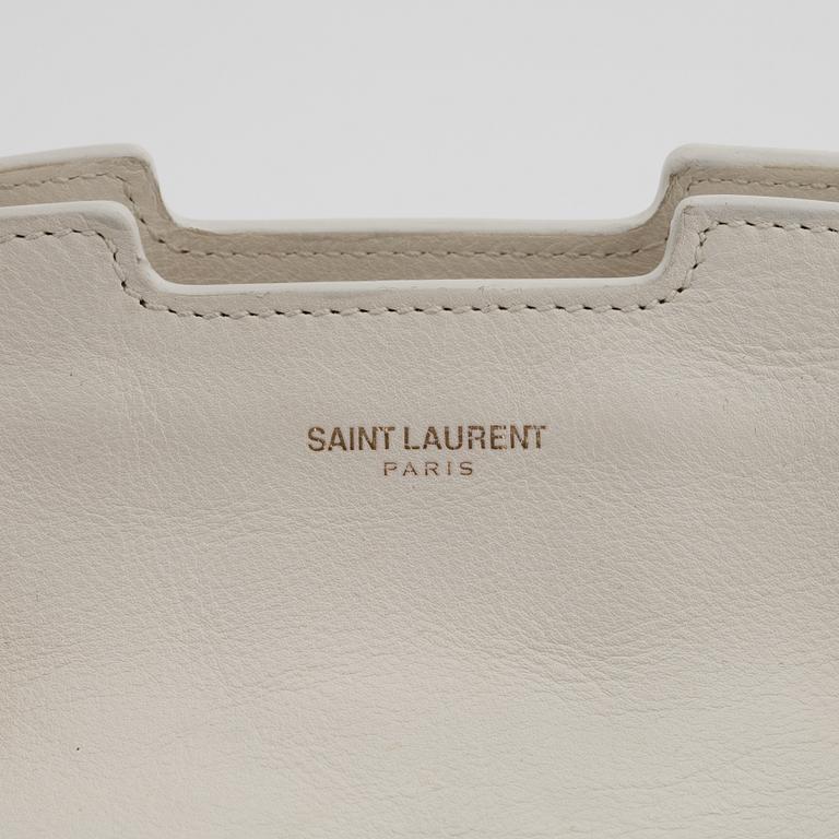 Yves Saint Laurent, a white leather handbag.