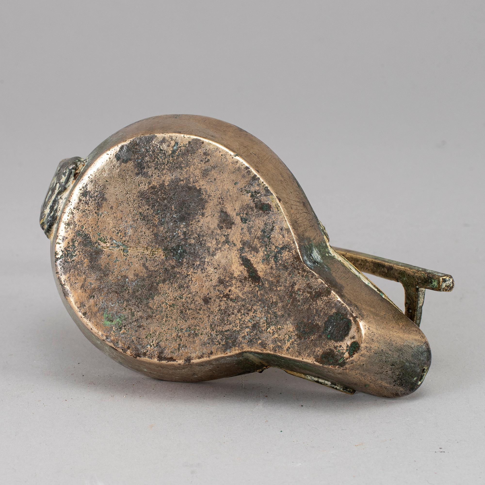 An 18th century bronze oil lamp.