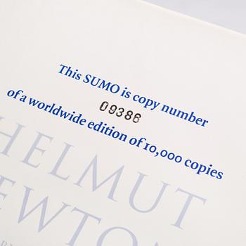 Helmut Newton, Signed book published by Taschen, Monte Carlo, 1999, ed 10000, with a metal table.