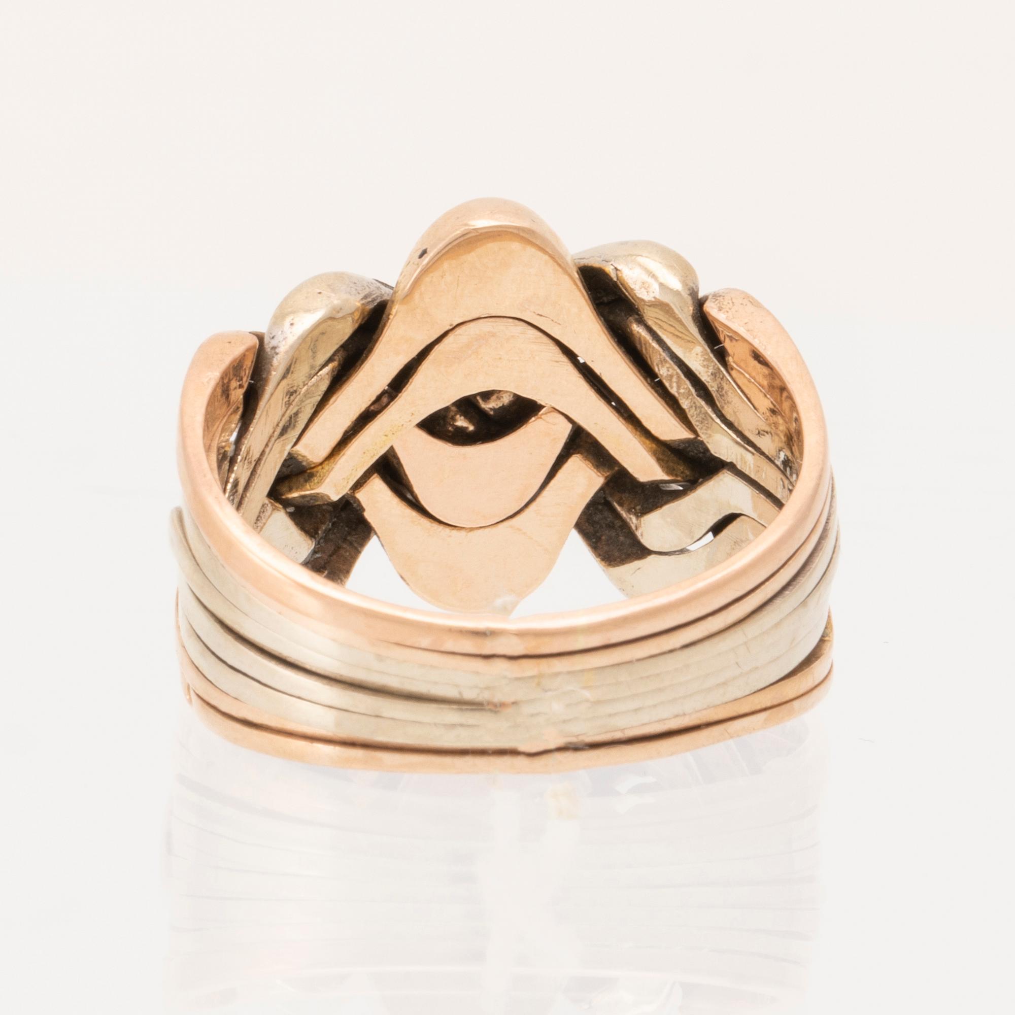 Ring "Pusselring" 14K rosé, vitt och rött guld.