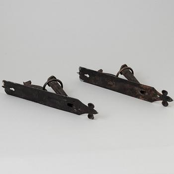 A pair of 20th century wrought iron torch holders.