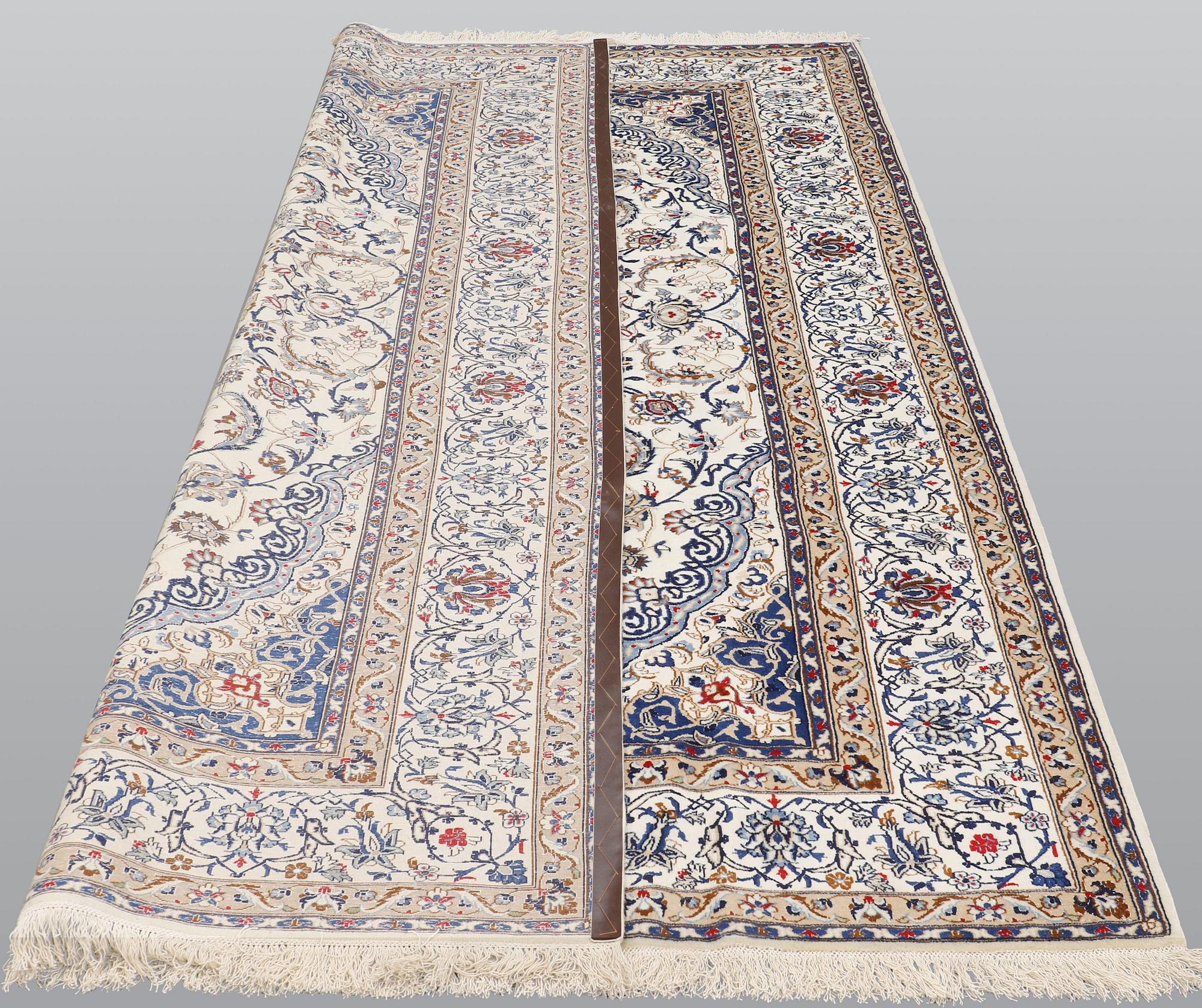 A carpet, Nain Part silk, 312 x 207 cm.