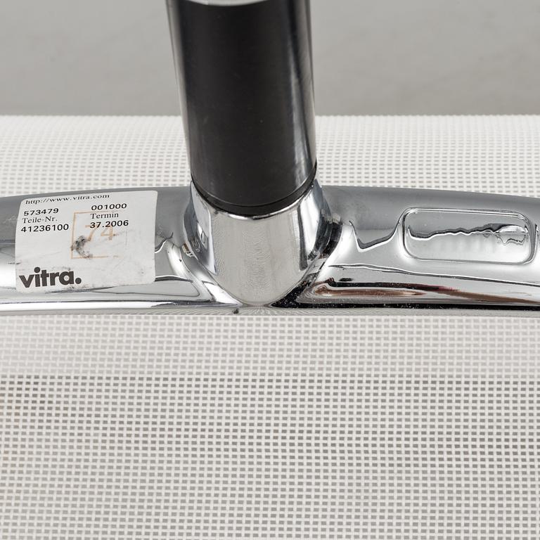 A pair of 'EA 108' desk chairs by Charles & Ray Eames for Vitra.