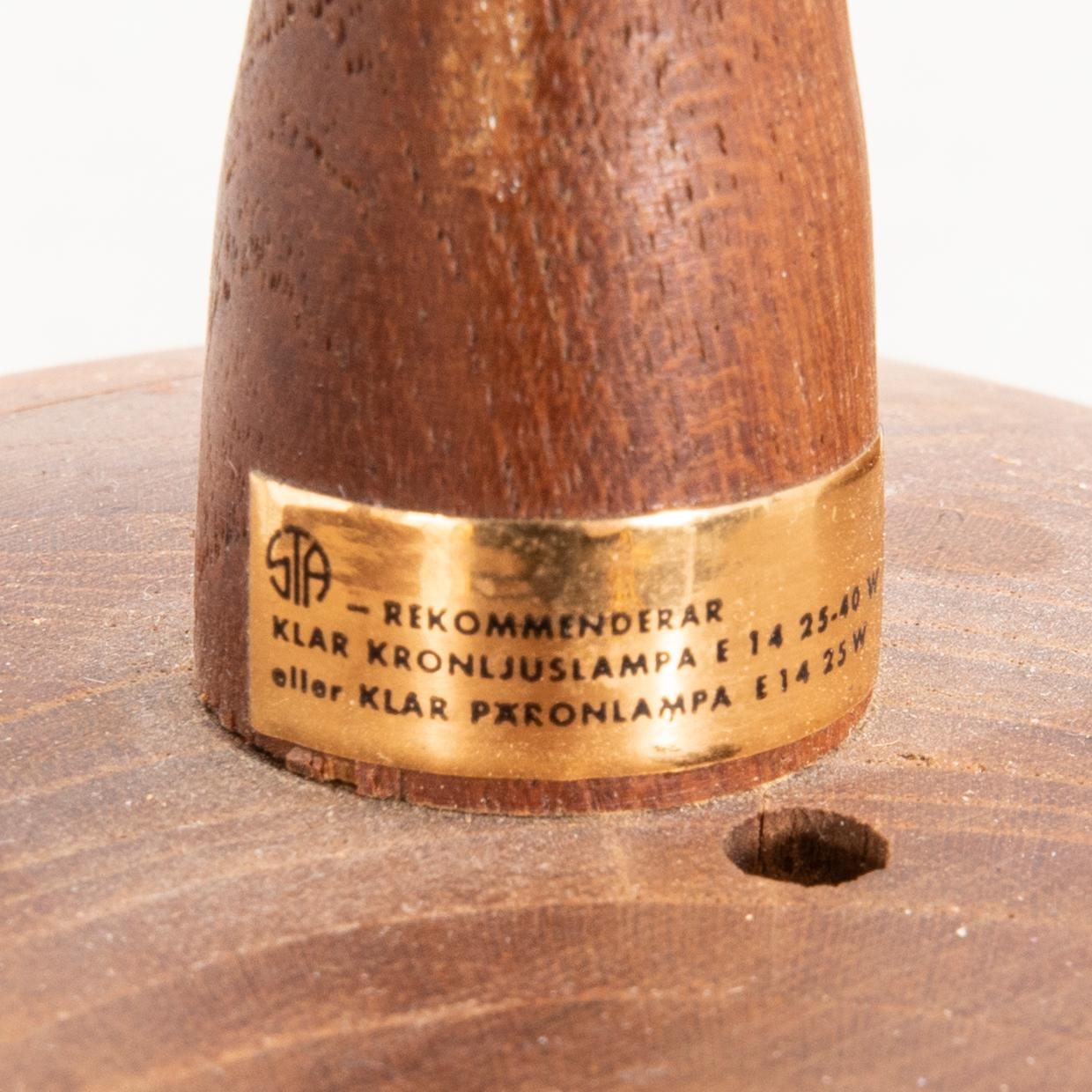 A 1960s teak ceiling pendant from Stilarmatur Tranås.