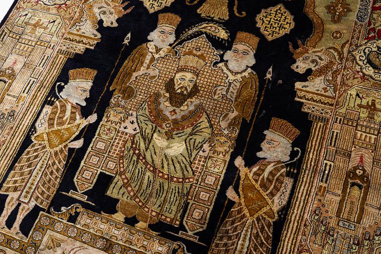 A pictorial semi-antique silk Qum rug, central Persia, c. 214 x 146 cm.