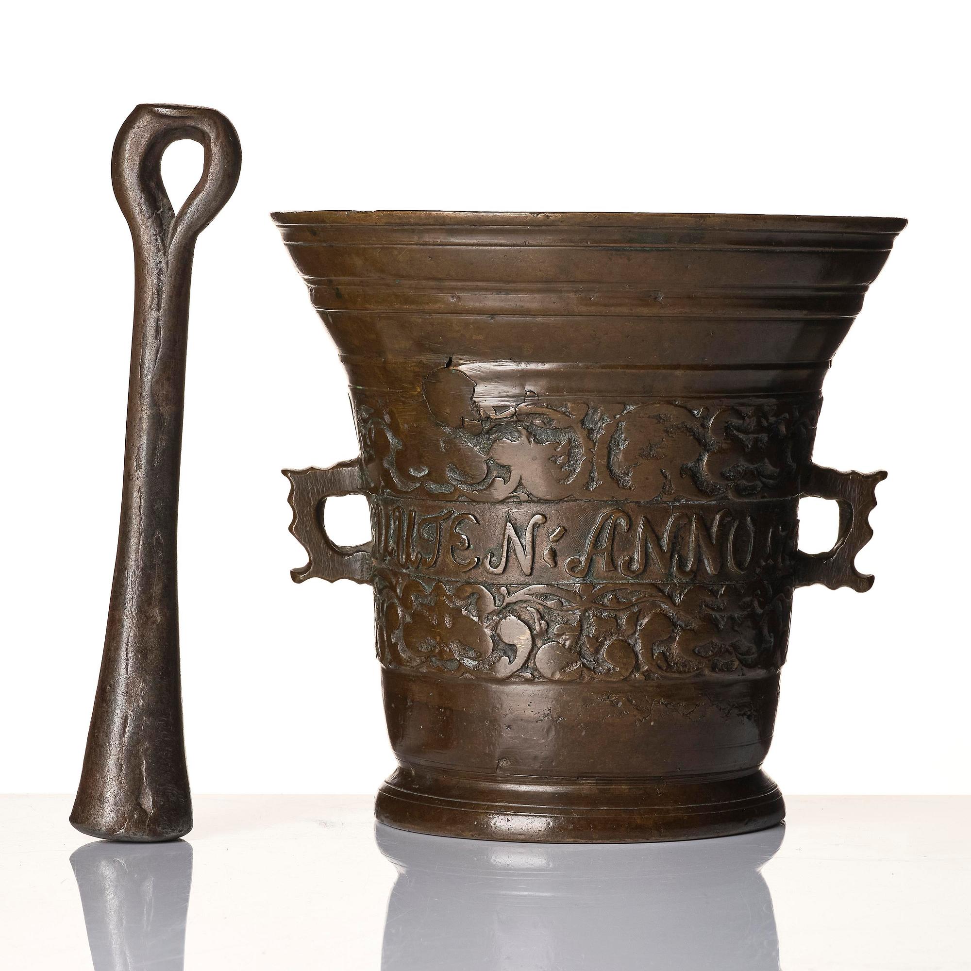 A Swedish late baroque bronze mortar and pestle, dated 1759.