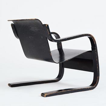 Alvar Aalto, a black lacquered birch cantilevered armchair, "nr 42", O.y Huonekalu-ja Rakennustyötehdas, Finland, 1930's.