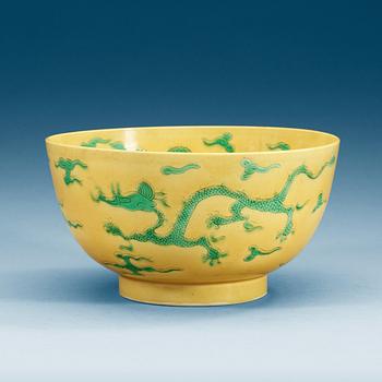 1828. A Chinese yellow glazed dragon bowl, presumably Republic.