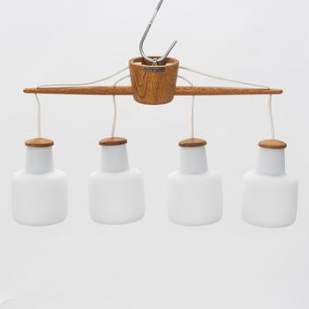 Uno & Östen Kristiansson, an oak and glass ceiling light, Luxus, Vittsjö.