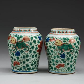 A pair of Transitional Wucai jars, 17th Century.