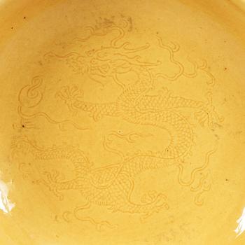 A Yellow glazed dish, Qing dynasty, with Daoguang seal mark and period (1821-1850).