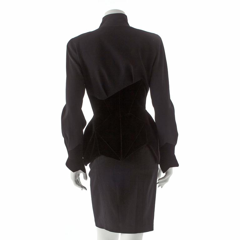 THIERRY MUGLER, a two-piece black wool and velvet dress consisting of jacket and skirt.