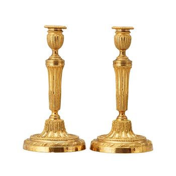 1287. A pair of Louis XVI late 18th century candlesticks.