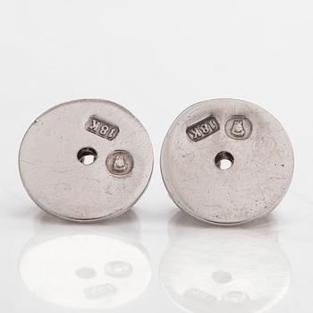 A pair of brilliant-cut diamond stud earrings in 18K white gold.