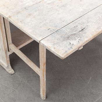 A painted gustavian gate-leg table, around the year 1800.