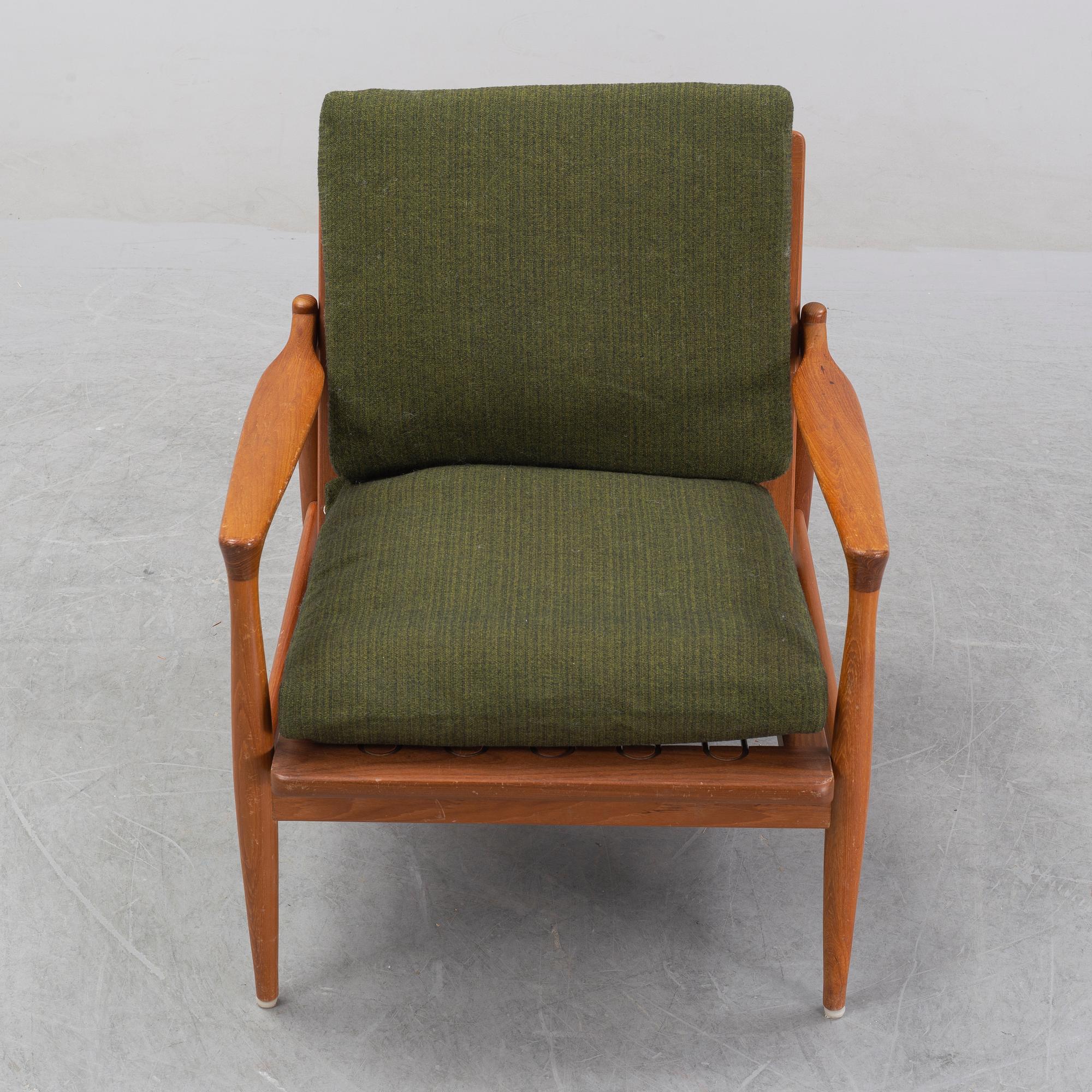 A 1950's/60's teak and oak easy chair.