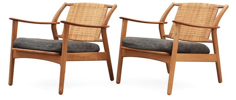 A pair of Danish teak and ratten armchairs, attributed, 1950's-60's.