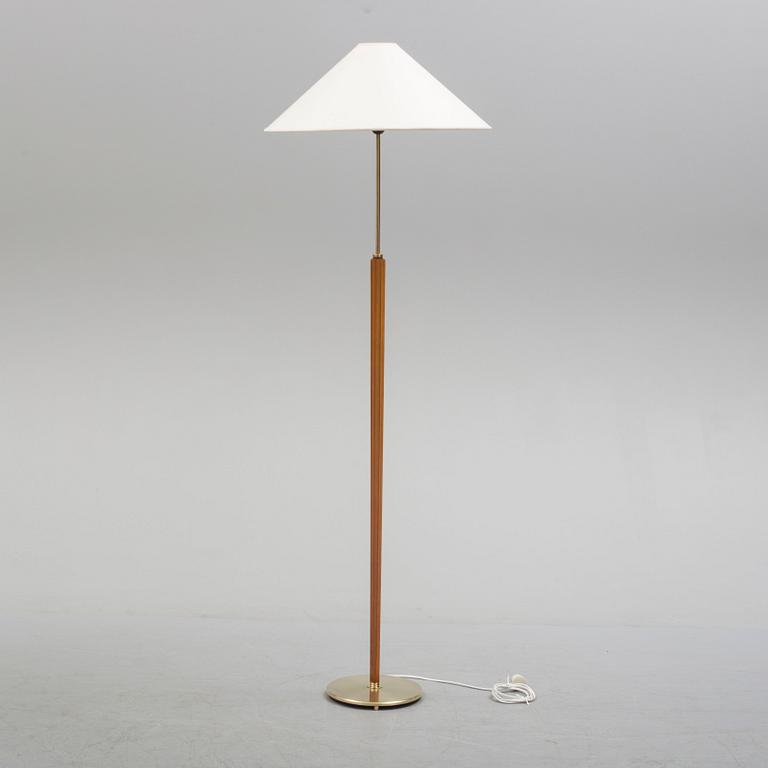 A Bergboms brass and beech standard light, 1940's.