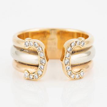 Cartier "Double C" ring in 18K tri-colour gold with round brilliant-cut diamonds.