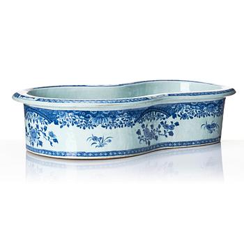 A blue and white bidet with a wooden stand, Qing dynasty, Qianlong (1736-95).